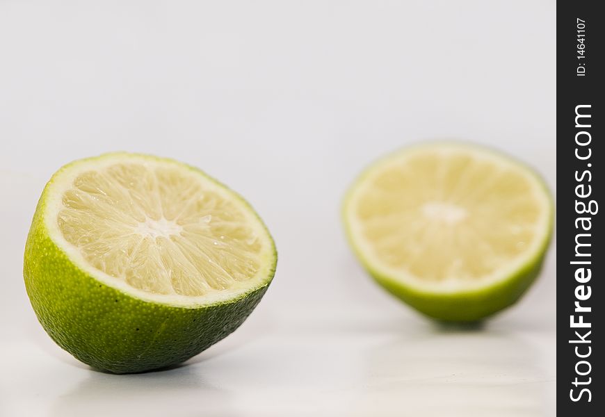 Fresh green lime fruit towards white background. Fresh green lime fruit towards white background