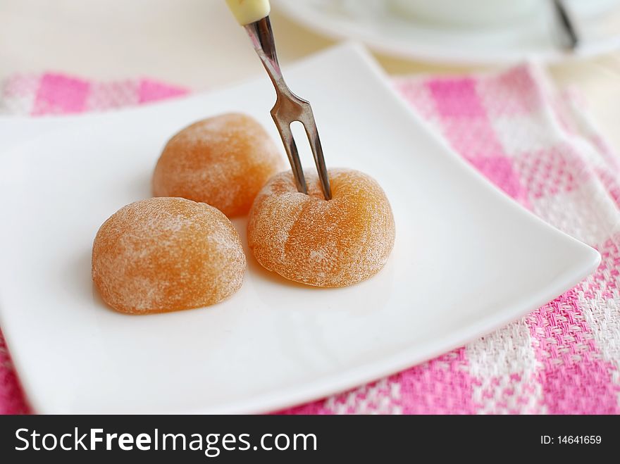 Fork taking sweets on plate. For concepts such as food and beverage, diet and nutrition, and healthy lifestyle.