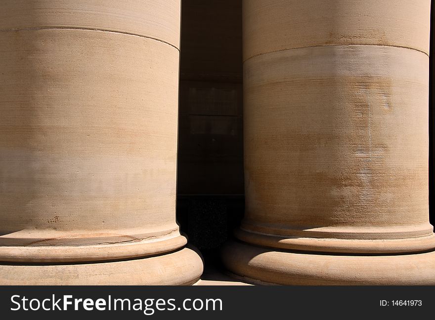 Two huge pillars of an historic court house. Two huge pillars of an historic court house