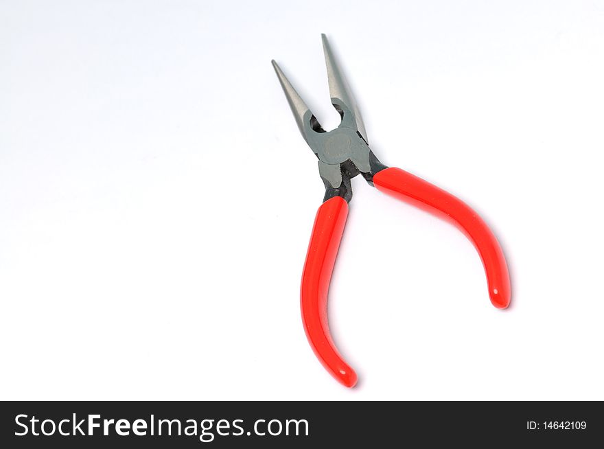 Red handle pliers on a white background .