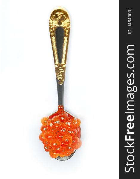 Teaspoon of red caviar on a white background