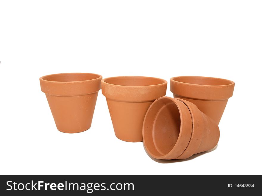 Five clay pots on white. Five clay pots on white