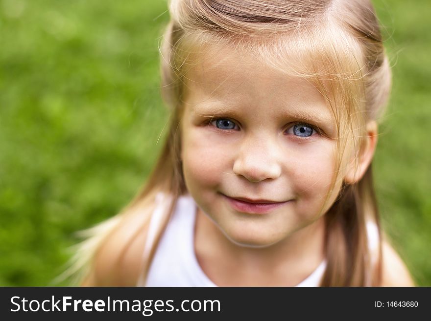 Closeup portrait of smiling little girl outdoor