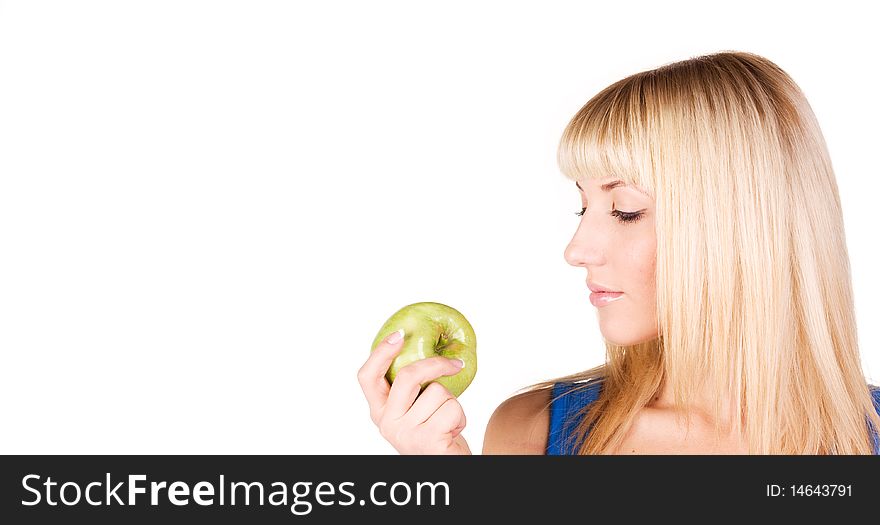 Portrait of a beautiful blonde who looks at the apple. Portrait of a beautiful blonde who looks at the apple