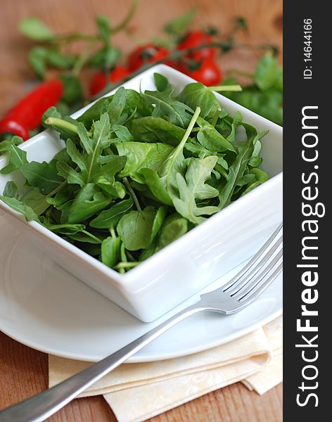 Mixed rocket, spinach and watercress in a bowl. Mixed rocket, spinach and watercress in a bowl