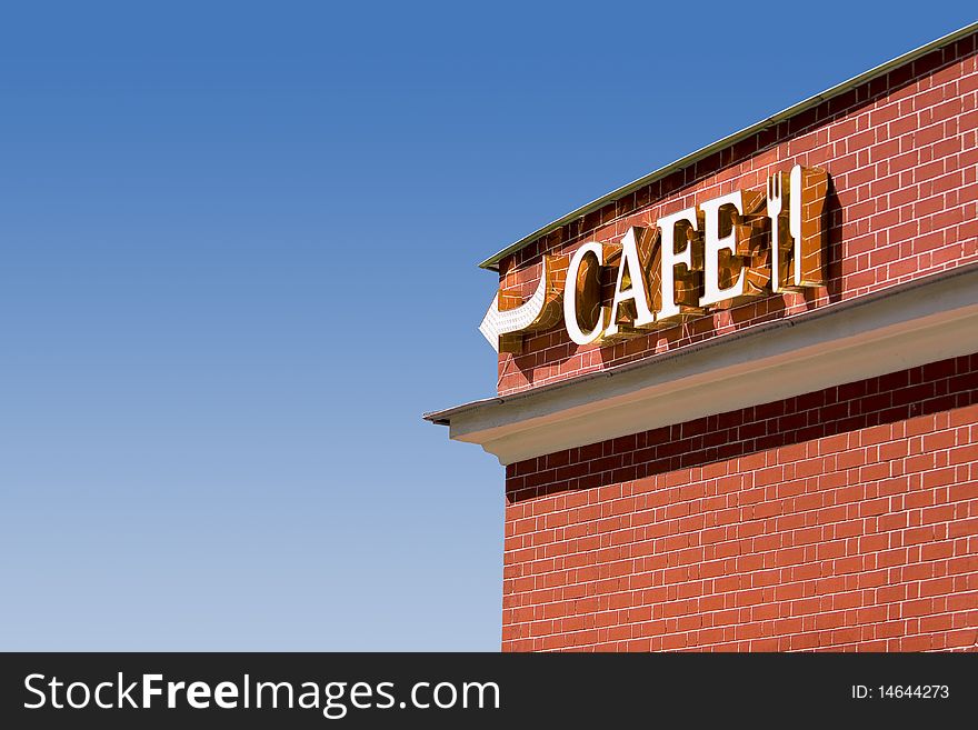 Background brick cafe direction red signboard wall blue sky day. Background brick cafe direction red signboard wall blue sky day