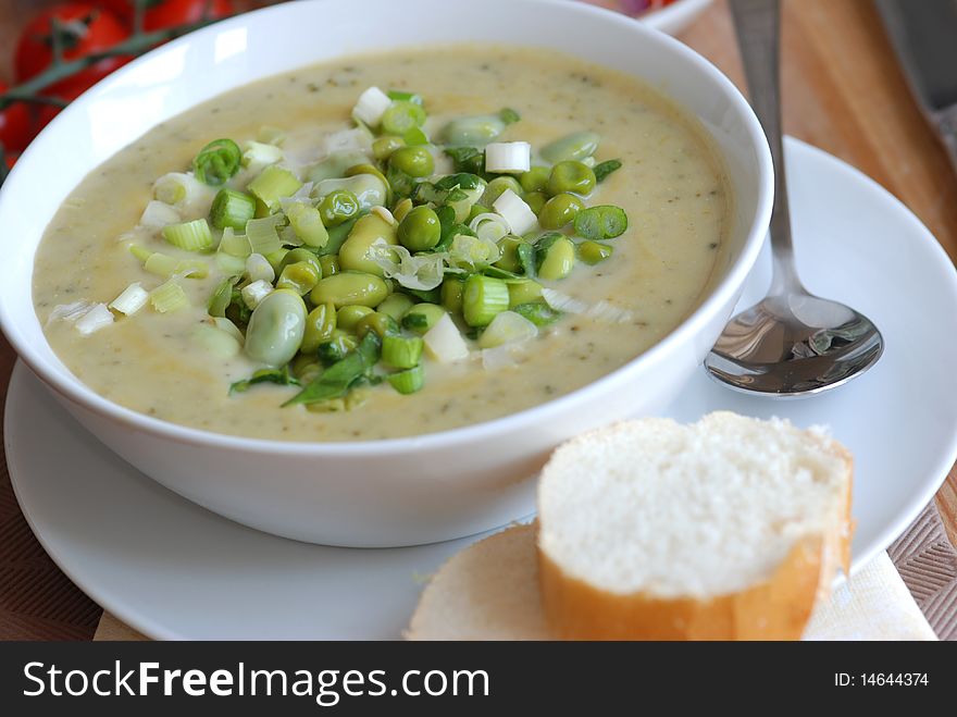 Freshly made edamame and pea soup in a bowl