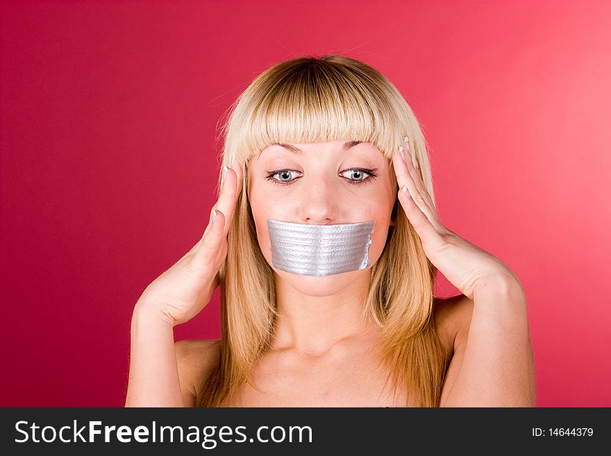 Young blond woman having a headache close up