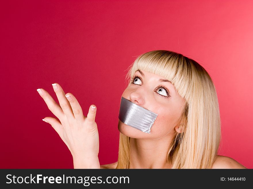 Girl with a scotch mouth shows his hand up. Girl with a scotch mouth shows his hand up