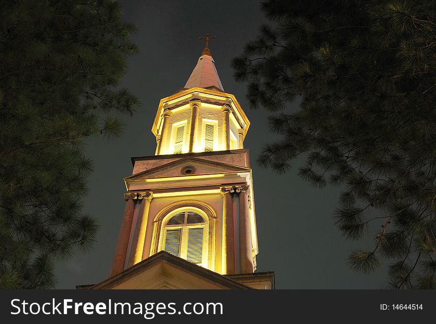 A historic cross of the church with black background. A historic cross of the church with black background.