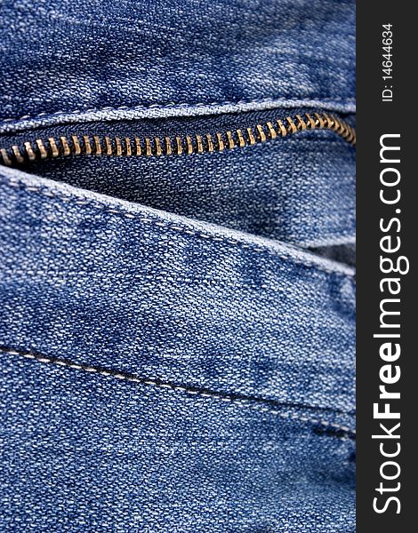 Closeup of blue jeans with zipper.