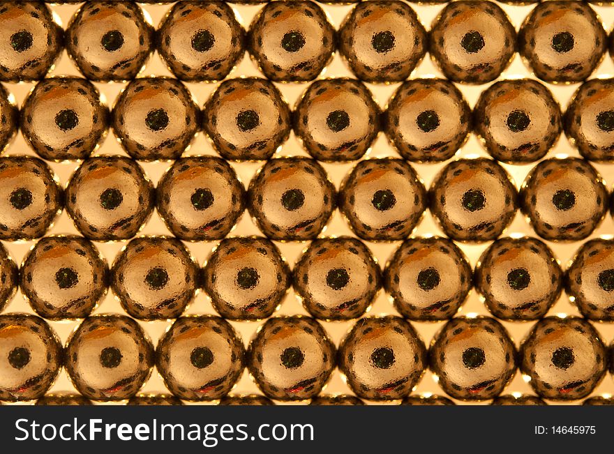 Shiny gold beads abstract background. selective focus. Shiny gold beads abstract background. selective focus.