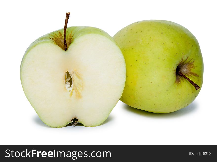 Big green slited apple and whole apple