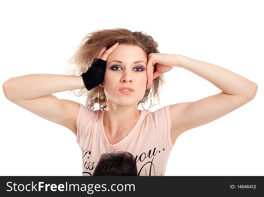 Young fashion model with her hands at her head. Isolated over white.