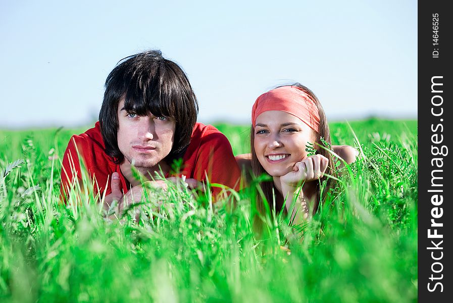 Boy with beautiful girl on grass. Boy with beautiful girl on grass