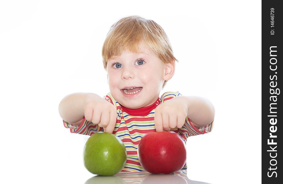 The little boy with apples in hands on a background. The little boy with apples in hands on a background