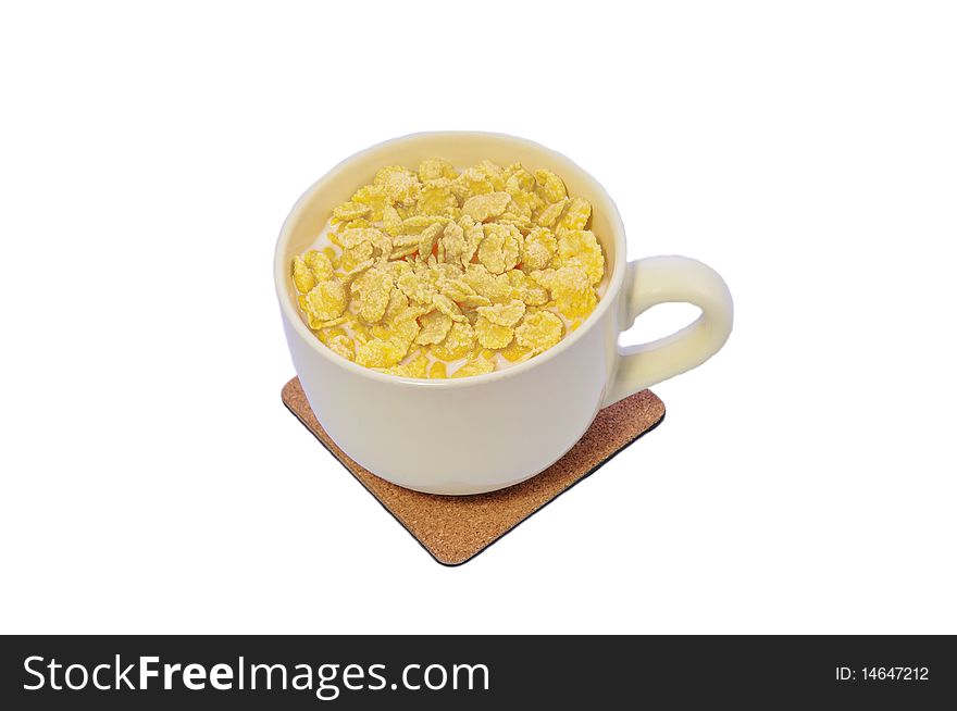 Isolated cup with corn flakes and milk. Isolated cup with corn flakes and milk