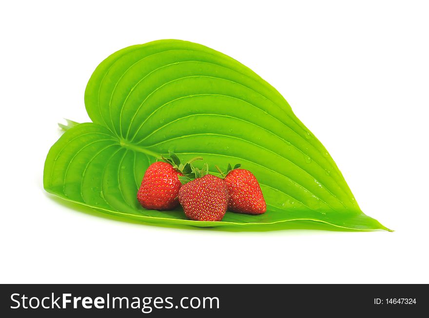Strawberry with leafs isolated on white