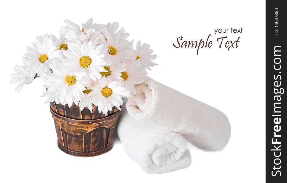 Flowers and towels isolated on white