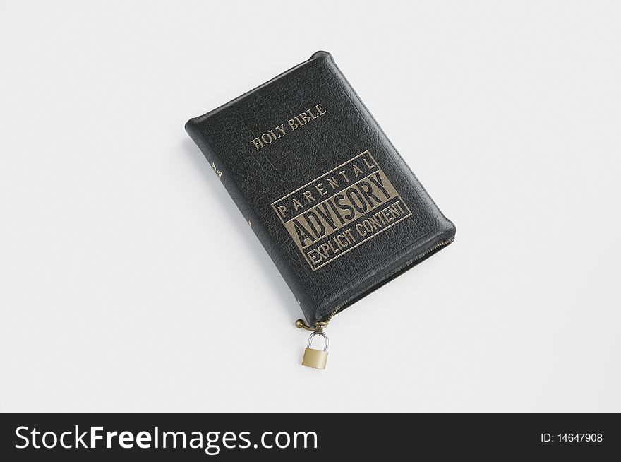 A leather bound bible with an advisory warning stamped on the cover. A leather bound bible with an advisory warning stamped on the cover