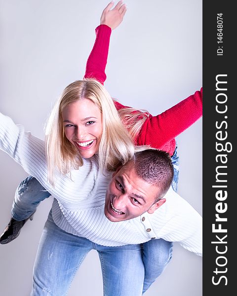 Happy Young loving couple hugging and smile , studio shot