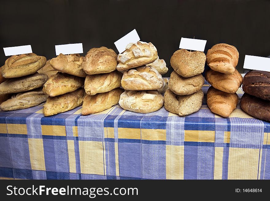 A market stall with a variety  of home baked bread. A market stall with a variety  of home baked bread