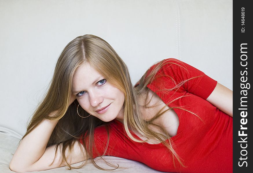 Beautiful girl lying on the couch