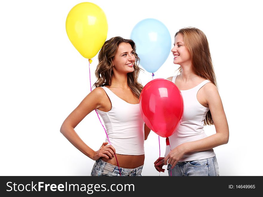 Two beautiful young girlfriends with color balloons. Two beautiful young girlfriends with color balloons