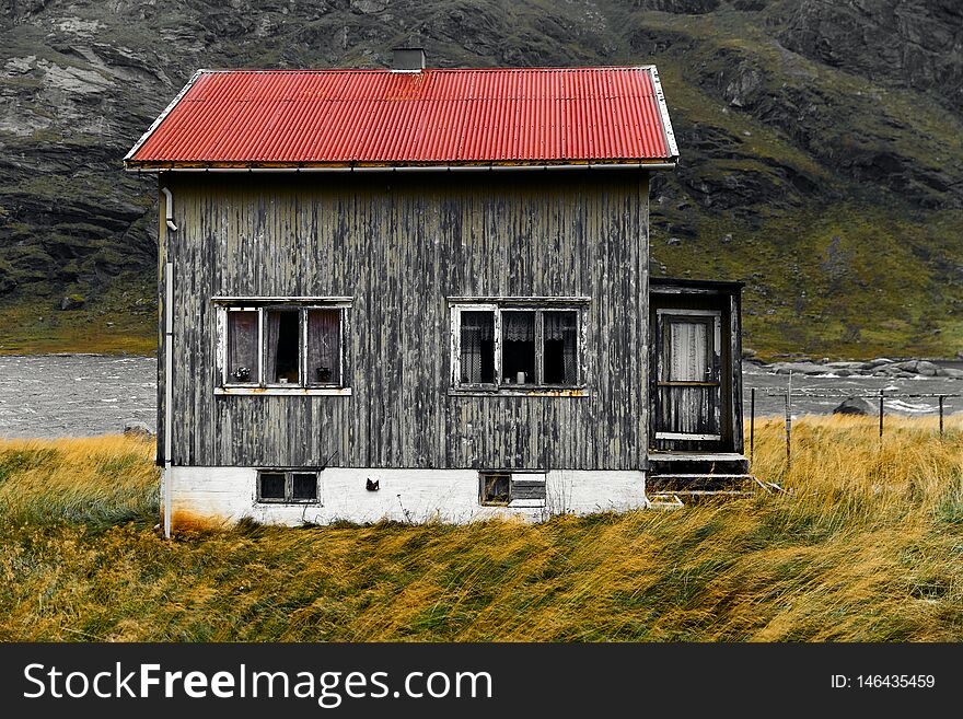 The house is weathered and abandoned with a red roof. It is located near the village Vinstad and Bunes Beach. The house is weathered and abandoned with a red roof. It is located near the village Vinstad and Bunes Beach.