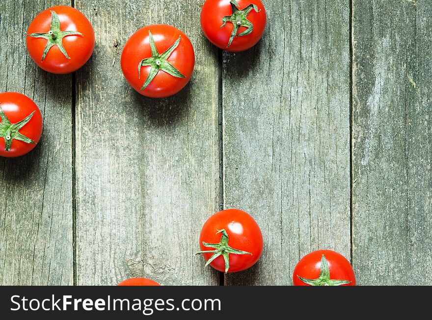 Fresh Tomatoes On Rustic Wooden Background.