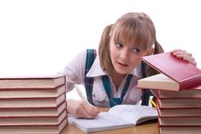 Schoolgirl Is Watching Furtively Textbook. Royalty Free Stock Images