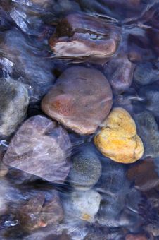 Coloured Pebbles In Running Water Royalty Free Stock Image Coloured Pebbles In Running Water Royalty Free Stock Image