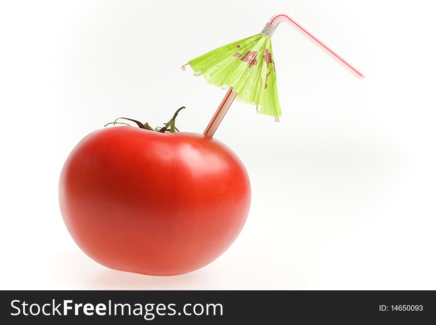 Tomato with straw and umbrella isolated on white background