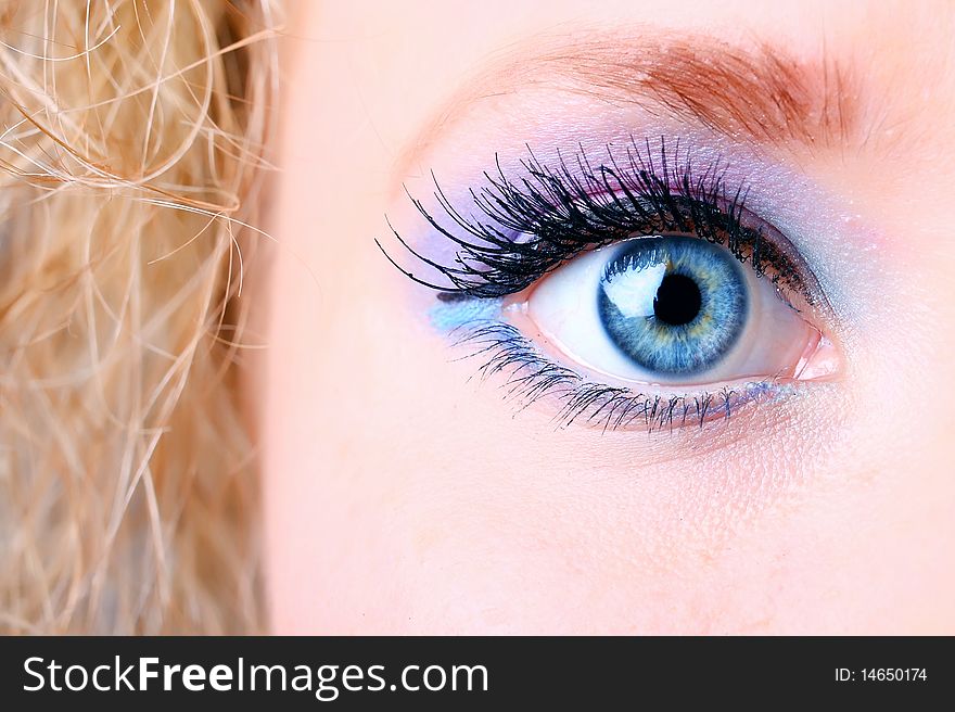 Woman eye with extremely long eyelashes.