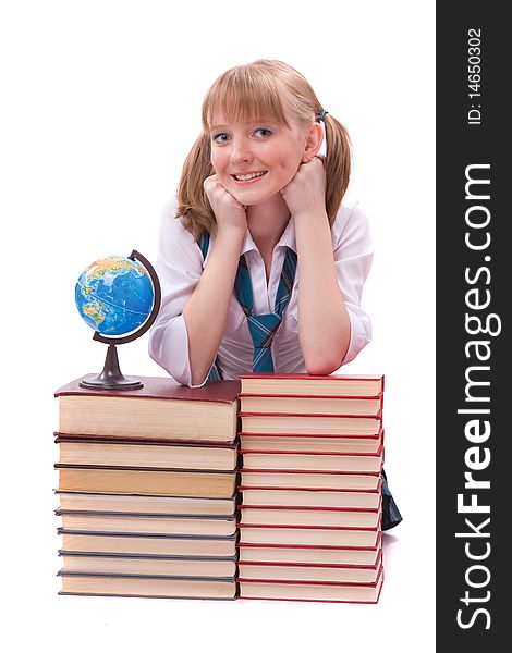 Senior high school student in uniform with the stack of book and globe. A young and beautiful schoolgirl is wearing a traditional uniform with textbooks. Senior high school student in uniform with the stack of book and globe. A young and beautiful schoolgirl is wearing a traditional uniform with textbooks.