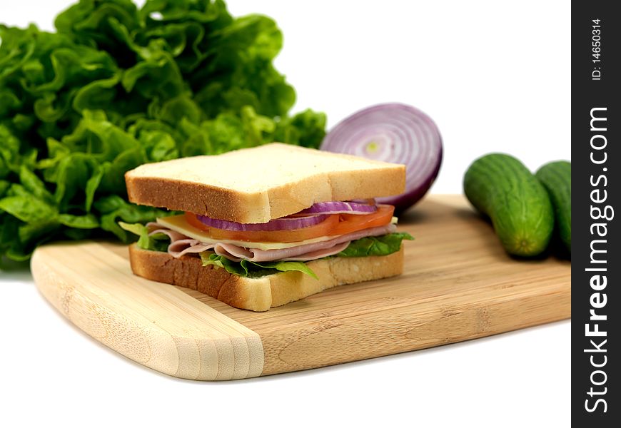 A freshly made ham sandwich on a kitchen bench