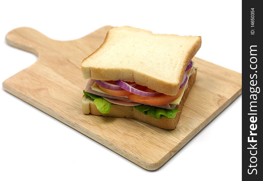 A freshly made ham sandwich on a kitchen bench