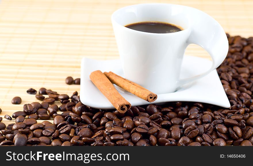 Cup of coffee on top of coffee beans. Cup of coffee on top of coffee beans