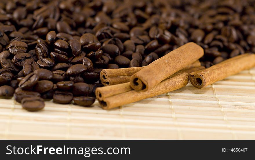 Coffee Beans And Cinnamon Sticks Closeup