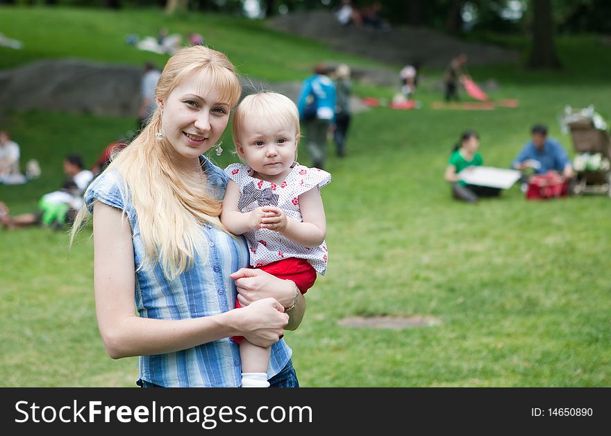 Happy mom and baby in the park. Happy mom and baby in the park