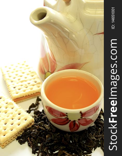 Ceramic tea pot and biscuit