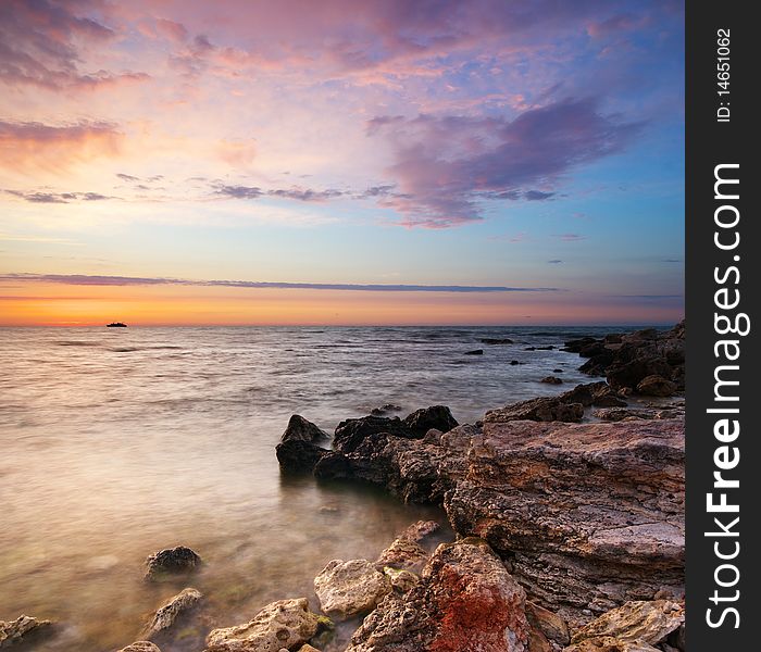 Sea and rock at the sunset. Nature composition. Sea and rock at the sunset. Nature composition.