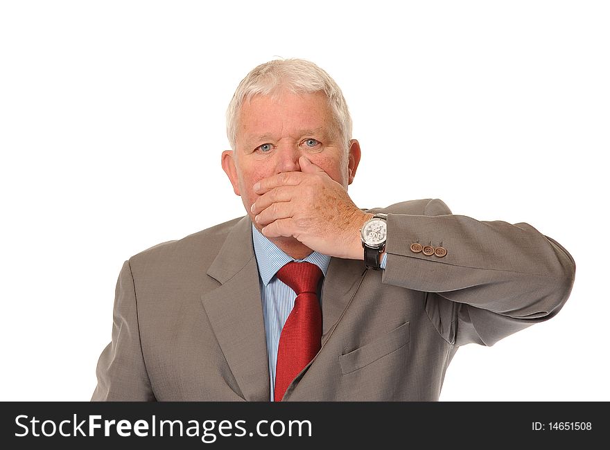 Successful mature businessman covering mouth