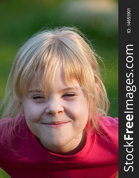 Portrait of little smiling girl outdoor