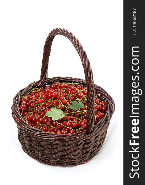 Redcurrants in a basket on a white background