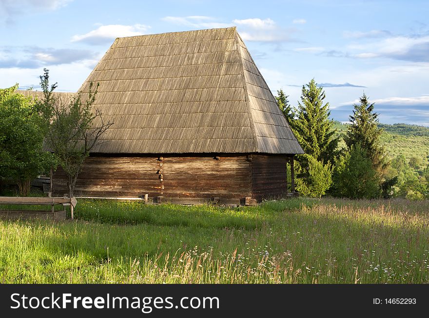 Traditional village with wooden houses covered with withered plants. Traditional village with wooden houses covered with withered plants