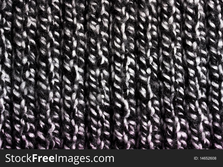 Black sweater texture background closeup