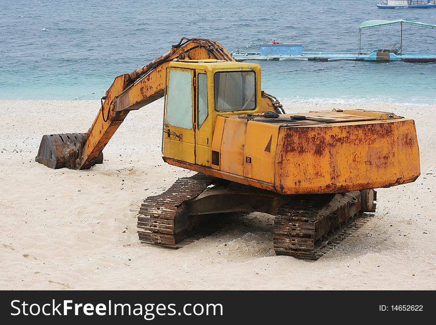 Rusted Digger On A Beautiful White Beach