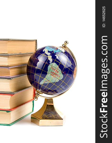 Globe and books isolated on a white background