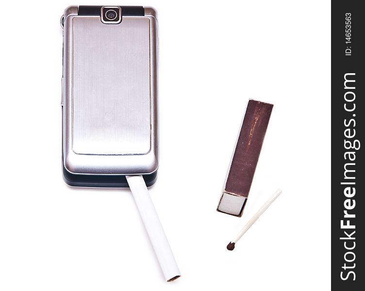 Cigarette with phone near box of matches isolated on the white